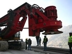 Rescue personnel move a digging machine during rescue operation for workers trapped in the Silkyara under construction road tunnel, days after it collapsed in the Uttarkashi district of India's Uttarakhand state.