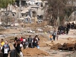 Israel-Hamas War: Palestinians leaving the north walk through the Salaheddine road in the Zeitoun district on the southern outskirts of Gaza City. Israel-Hamas War: Palestinians leaving the north walk through the Salaheddine road in the Zeitoun district on the southern outskirts of Gaza City.