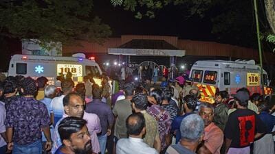 People gather outside after a stampede at the venue of a music concert at the Cochin University of Science and Technology in Kochi on Saturday. Four people died and dozens of students were injured in the incident. (AP) People gather outside after a stampede at the venue of a music concert at the Cochin University of Science and Technology in Kochi on Saturday. Four people died and dozens of students were injured in the incident. (AP)
