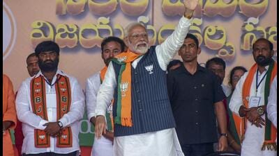 Prime Minister Narendra Modi waves to supporters during a public meeting at Maheshwaram ahead of Telangana assembly elections, in Ranga Reddy district (PTI) Prime Minister Narendra Modi waves to supporters during a public meeting at Maheshwaram ahead of Telangana assembly elections, in Ranga Reddy district (PTI)