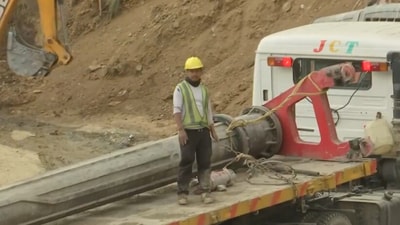 A section of the vertical drilling machine was observed being transported to the top of the Silkyara Tunnel on Saturday. (PTI) A section of the vertical drilling machine was observed being transported to the top of the Silkyara Tunnel on Saturday. (PTI)