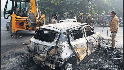 The bodies were recovered on Saturday morning from a gutted white Swift hatchback parked outside Amrapali Platinum Society in Sector 119. (Sunil Ghosh/HT Photo) The bodies were recovered on Saturday morning from a gutted white Swift hatchback parked outside Amrapali Platinum Society in Sector 119. (Sunil Ghosh/HT Photo)