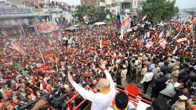 Union home minister Amit Shah waves at his supporters during a roadshow for the Telangana assembly elections, in Nalgonda (ANI) Union home minister Amit Shah waves at his supporters during a roadshow for the Telangana assembly elections, in Nalgonda (ANI)
