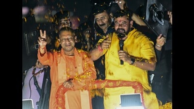 Uttar Pradesh chief minister Yogi Adityanath with a BJP candidate during a road show ahead of Telangana assembly elections, in Hyderabad, on November 25, 2023. (PTI) Uttar Pradesh chief minister Yogi Adityanath with a BJP candidate during a road show ahead of Telangana assembly elections, in Hyderabad, on November 25, 2023. (PTI)