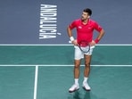Serbia's Novak Djokovic reacts during his match with his teammate Miomir Kecmanovic against Italy's Jannik Sinner and Lorenzo Sonego Serbia's Novak Djokovic reacts during his match with his teammate Miomir Kecmanovic against Italy's Jannik Sinner and Lorenzo Sonego