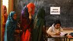 Women at a polling station in Rajasthan’s Ajmer on Saturday. (REUTERS)
