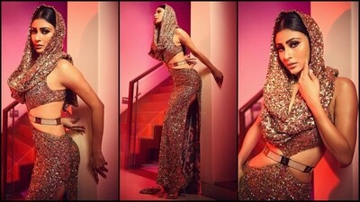 Mouni Roy is here to add some gold and glitter to your Sunday. The stylish actress recently donned a mesmerising shimmering dress that oozes oomph. Mouni is a total stunner who can pull off any look to perfection. Whether it's a casual dress or a sartorial saree, she transforms any outfit into a glamorous affair. Mouni is quite active on social media and her stunning Insta-diaries filled with fashion-forward looks are nothing short of a treasure trove of style inspiration for all her followers. Her latest shimmer-wrapped look is no exception and is sure to steal your heart. Scroll down to take notes. (Instagram/@imouniroy) Mouni Roy is here to add some gold and glitter to your Sunday. The stylish actress recently donned a mesmerising shimmering dress that oozes oomph. Mouni is a total stunner who can pull off any look to perfection. Whether it's a casual dress or a sartorial saree, she transforms any outfit into a glamorous affair. Mouni is quite active on social media and her stunning Insta-diaries filled with fashion-forward looks are nothing short of a treasure trove of style inspiration for all her followers. Her latest shimmer-wrapped look is no exception and is sure to steal your heart. Scroll down to take notes. (Instagram/@imouniroy)