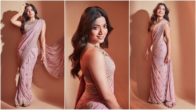 Rashmika Mandanna is currently gearing up for the release of her upcoming film Animal and her gorgeous back to back promotional looks in breathtaking sarees are stealing our hearts. The beautiful actress is a total stunner and can pull off any look to perfection whether it's a casual dress or a traditional suit. Earlier she sizzled in a lovely black saree and this time in a light pink gold work adorned saree, she proves her fashion finesses. With the wedding season upon us, Rashmika's saree looks will definitely inspire your ethnic wardrobe. Scroll down to take some fashion notes. (Instagram/@rashmika_mandanna) Rashmika Mandanna is currently gearing up for the release of her upcoming film Animal and her gorgeous back to back promotional looks in breathtaking sarees are stealing our hearts. The beautiful actress is a total stunner and can pull off any look to perfection whether it's a casual dress or a traditional suit. Earlier she sizzled in a lovely black saree and this time in a light pink gold work adorned saree, she proves her fashion finesses. With the wedding season upon us, Rashmika's saree looks will definitely inspire your ethnic wardrobe. Scroll down to take some fashion notes. (Instagram/@rashmika_mandanna)