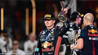 Red Bull Racing's Dutch driver Max Verstappen celebrates with the trophy on the podium after the Abu Dhabi Formula One Grand Prix at the Yas Marina Circuit (AFP) Red Bull Racing's Dutch driver Max Verstappen celebrates with the trophy on the podium after the Abu Dhabi Formula One Grand Prix at the Yas Marina Circuit (AFP)