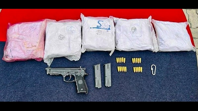 Heroin, pistol, cartridges and other items recovered by the Border Security Force (BSF), in Amritsar. (PTI) Heroin, pistol, cartridges and other items recovered by the Border Security Force (BSF), in Amritsar. (PTI)