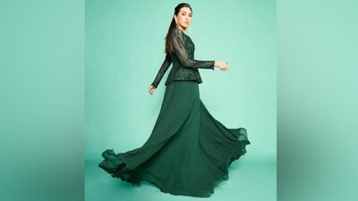 Karisma exuded elegance in the attire featuring a peplum jacket and a sharara set. While the blouse features shimmering sequin embellishments embroidery in swirl patterns, a round neckline with front split, full-length sheer sleeves, and a peplum design on the hem, the sharara has a layered silhouette, flared hem, and a floor-grazing length. (Instagram) Karisma exuded elegance in the attire featuring a peplum jacket and a sharara set. While the blouse features shimmering sequin embellishments embroidery in swirl patterns, a round neckline with front split, full-length sheer sleeves, and a peplum design on the hem, the sharara has a layered silhouette, flared hem, and a floor-grazing length. (Instagram)