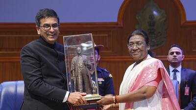 President Droupadi Murmu (R) being felicitated by Chief Justice of India DY Chandrachud on Sunday. (PTI) President Droupadi Murmu (R) being felicitated by Chief Justice of India DY Chandrachud on Sunday. (PTI)