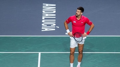 Serbia's Novak Djokovic reacts during his match with his teammate Miomir Kecmanovic against Italy's Jannik Sinner and Lorenzo Sonego (AP) Serbia's Novak Djokovic reacts during his match with his teammate Miomir Kecmanovic against Italy's Jannik Sinner and Lorenzo Sonego (AP)