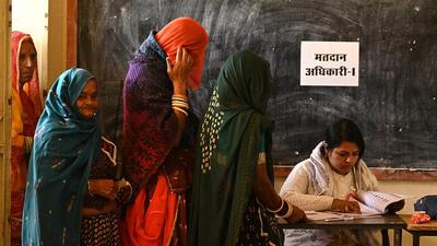 Women at a polling station in Rajasthan’s Ajmer on Saturday. (REUTERS)