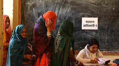Women wait in a queue to cast their votes at a polling station during Rajasthan state assembly election in Ajmer (REUTERS) Women wait in a queue to cast their votes at a polling station during Rajasthan state assembly election in Ajmer (REUTERS)