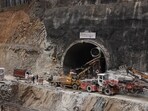 Heavy machinery sits outside the tunnel during rescue operations where construction workers got trapped in Uttarkashi.
