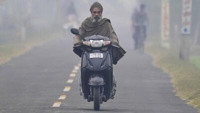 A commuter travelling during a foggy morning in Ludhiana. (Gurpreet Singh/HT)