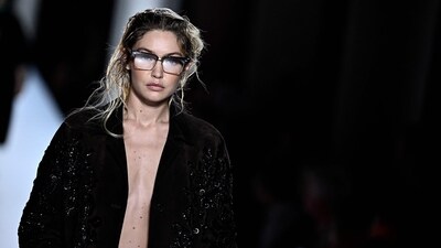 US model Gigi Hadid walks the runway with models to present creations by Miu Miu during the Paris Fashion Week Womenswear Spring/Summer 2024 in Paris on October 3, 2023. (Photo by JULIEN DE ROSA / AFP) (AFP) US model Gigi Hadid walks the runway with models to present creations by Miu Miu during the Paris Fashion Week Womenswear Spring/Summer 2024 in Paris on October 3, 2023. (Photo by JULIEN DE ROSA / AFP) (AFP)