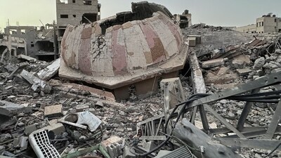 Houses destroyed in Israeli strikes during the conflict lie in ruin, amid a temporary truce between Israel and the Palestinian Islamist group Hamas, in Beach refugee camp, in Gaza City November 26, 2023 (REUTERS/Abed Sabah) (REUTERS)