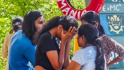Bereaved classmates of four students who died after a stampede during the annual festival of Cochin University of Science and Technology (CUSAT). (PTI)