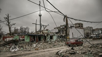 A car drives through an area destroyed after a strike in the city of Avdiivka, Donetsk Oblast, on March 18. (AFP) A car drives through an area destroyed after a strike in the city of Avdiivka, Donetsk Oblast, on March 18. (AFP)