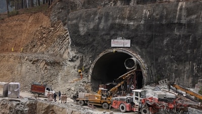 Heavy machinery sits outside the tunnel during rescue operations where construction workers got trapped in Uttarkashi. (Reuters)