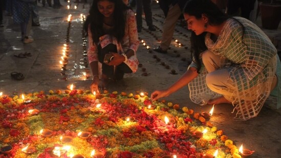 The festival includes a show featuring firecrackers, lasers, and music under the moonlit sky, accompanied by a green aerial firecracker display.(HT Photo/Rajesh Kumar)