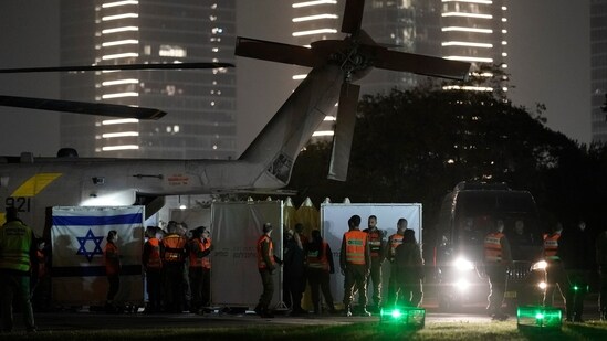 The exit of a helicopter is covered as hostages get-off, after being released from Gaza, at the helipad of the Schneider Children's Medical Center in Petah Tikva, Israel. (AP) The exit of a helicopter is covered as hostages get-off, after being released from Gaza, at the helipad of the Schneider Children's Medical Center in Petah Tikva, Israel. (AP)