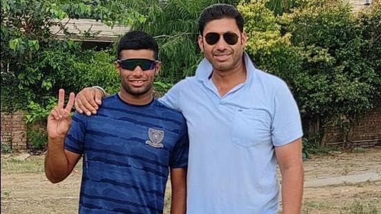 Ludhiana’s 18-year-old cricketer Aaradhya Shukla with his coach Amandeep. (HT Photo)
