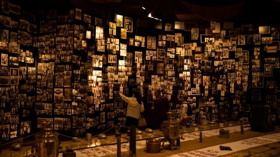 A family looks at photographs of fallen soldiers during World War II displayed inside the National Museum of the History of Ukraine. (AP (Representative Image))