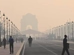 Commuters out on a smoggy morning amid rising air pollution on Kartavya Path in New Delhi. Commuters out on a smoggy morning amid rising air pollution on Kartavya Path in New Delhi.