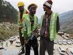 "Rat miners" stand before they begin manual drilling as rescue operations are in progress after workers got trapped in a collapse of an under-construction tunnel, in Uttarkashi, Uttarakhand. 