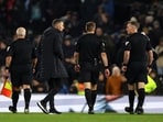 Wolves manager Gary O'Neil talks to the referee Michael Salisbury after the match
