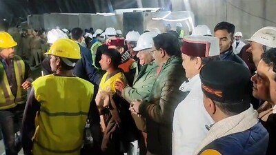 Uttarakhand CM Pushkar Singh Dhami meets the workers who were trapped inside the Silkyara tunnel after the rescue operation, in Uttarkashi on Tuesday. (ANI)
