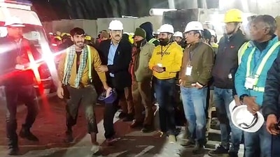 A worker along with a rescue personnel who evacuated him. (ANI) A worker along with a rescue personnel who evacuated him. (ANI)