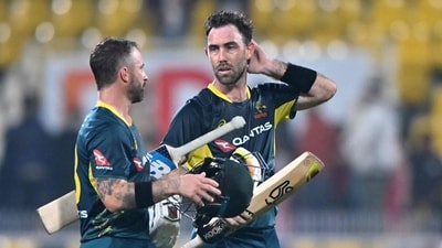 Australia's captain Matthew Wade (L) and teammate Glenn Maxwell come out of the ground after winning the third Twenty20 international cricket match (AFP)