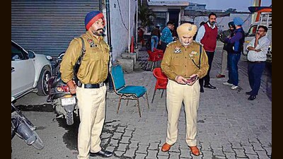 Cops at the spot where the two bike-borne men had targeted the filling station manager and his assistant, near Dholewal, in Ludhiana on Thursday. (Manish/HT)