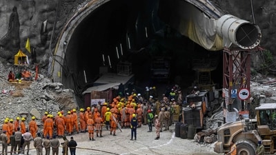 National Disaster Response Force (NDRF) personnel along with other rescue operatives gather near the face of the collapsed under construction Silkyara tunnel in the Uttarkashi district of India's Uttarakhand state, on November 28, (AFP) National Disaster Response Force (NDRF) personnel along with other rescue operatives gather near the face of the collapsed under construction Silkyara tunnel in the Uttarkashi district of India's Uttarakhand state, on November 28, (AFP)