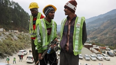 "Rat miners" stand before they begin manual drilling as rescue operations are in progress after workers got trapped in a collapse of an under-construction tunnel, in Uttarkashi, Uttarakhand. (REUTERS)
