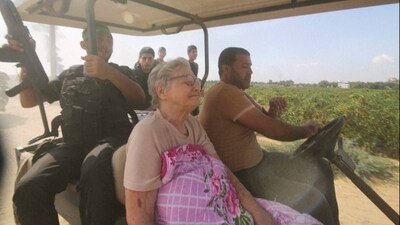 Hamas' militants transport Yaffa Adar, 85, an Israeli civilian kidnapped from Nir Oz, into the Gaza strip. (AP) Hamas' militants transport Yaffa Adar, 85, an Israeli civilian kidnapped from Nir Oz, into the Gaza strip. (AP)