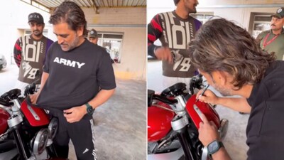 Snapshot of MS Dhoni signing the bike. (Instagram/@Sumeet Kumar Bajaj ) Snapshot of MS Dhoni signing the bike. (Instagram/@Sumeet Kumar Bajaj )