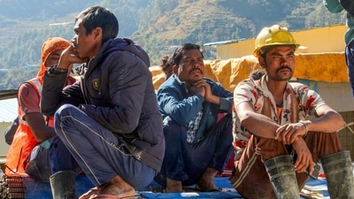 Locals and family members of trapped workers near the under-construction tunnel between Silkyara and Dandalgaon on the Brahmakhal-Yamunotri national highway, (PTI) Locals and family members of trapped workers near the under-construction tunnel between Silkyara and Dandalgaon on the Brahmakhal-Yamunotri national highway, (PTI)