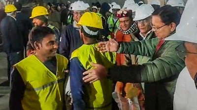 Uttarakhand Chief Minister Pushkar Singh Dhami and Union Minister of State for Road Transport & Highways VK Singh greet rescued workers coming out of the collapsed Silkyara Tunnel, in Uttarkashi district. (PTI) Uttarakhand Chief Minister Pushkar Singh Dhami and Union Minister of State for Road Transport & Highways VK Singh greet rescued workers coming out of the collapsed Silkyara Tunnel, in Uttarkashi district. (PTI)