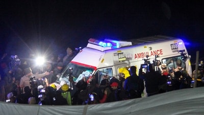 Ambulances with rescued workers come out of the collapsed Silkyara Tunnel, in Uttarkashi district, Tuesday. (PTI) Ambulances with rescued workers come out of the collapsed Silkyara Tunnel, in Uttarkashi district, Tuesday. (PTI)