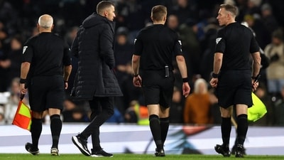 Wolves manager Gary O'Neil talks to the referee Michael Salisbury after the match (Reuters)