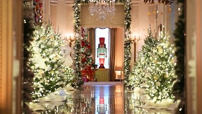 Christmas trees are seen in the East Room looking towards the Cross Hall during the media preview for the 2023 Holidays at the White House in Washington, DC on November 27, 2023 (Photo by Mandel NGAN / AFP) (AFP) Christmas trees are seen in the East Room looking towards the Cross Hall during the media preview for the 2023 Holidays at the White House in Washington, DC on November 27, 2023 (Photo by Mandel NGAN / AFP) (AFP)