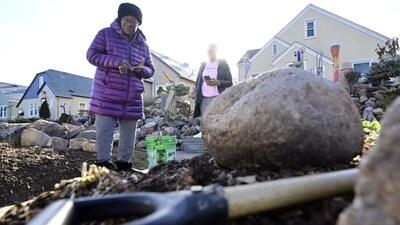 Decades-old mosaic of yard rocks and decorative art by women could face removal (AP photo) Decades-old mosaic of yard rocks and decorative art by women could face removal (AP photo)