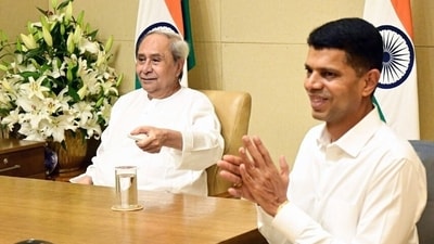 Odisha CM Naveen Patnaik with his close aide VK Pandian. (Odisha CMO) Odisha CM Naveen Patnaik with his close aide VK Pandian. (Odisha CMO)
