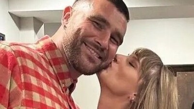 Travis Kelce can't stop smiling around Taylor Swift.