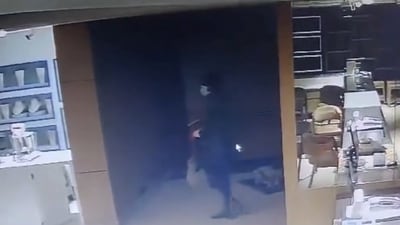 Masked man seen inside a store in Coimbatore. (PTI) Masked man seen inside a store in Coimbatore. (PTI)